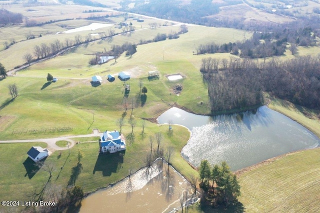 drone / aerial view featuring a water view and a rural view