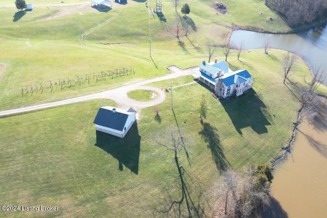 drone / aerial view featuring a rural view and a water view