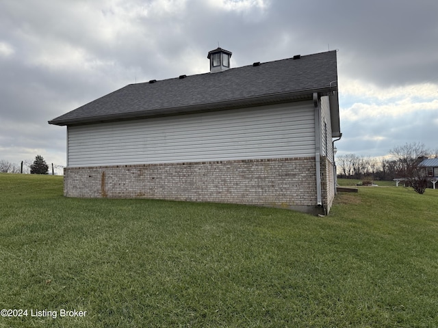 view of home's exterior featuring a yard