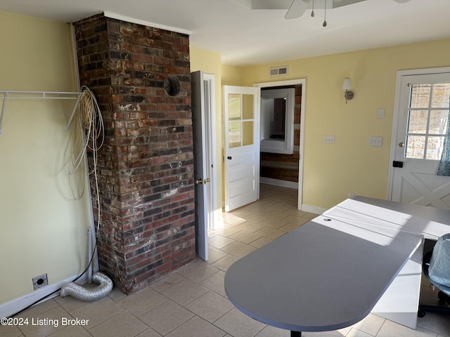 interior space featuring ceiling fan