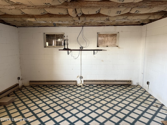 basement featuring a baseboard heating unit