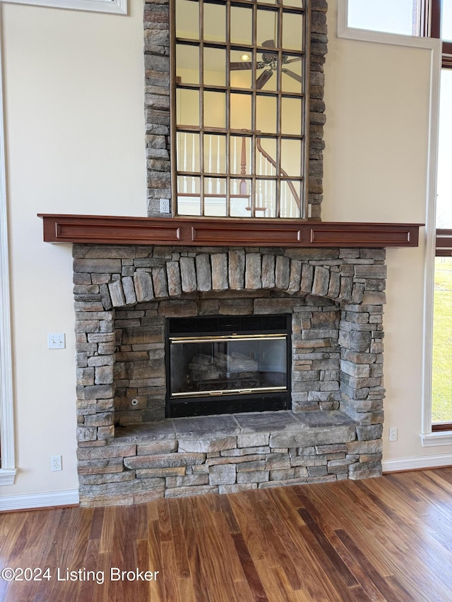 interior details featuring a fireplace and hardwood / wood-style flooring