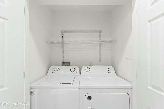 laundry room with washing machine and clothes dryer