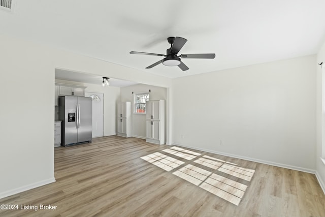 empty room featuring ceiling fan and light wood-type flooring