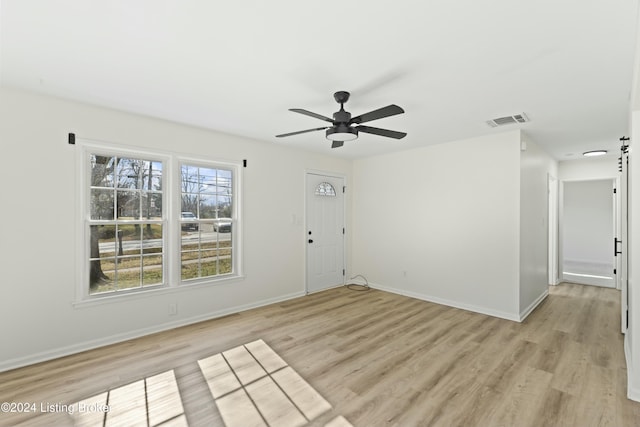 spare room featuring ceiling fan and light wood-type flooring