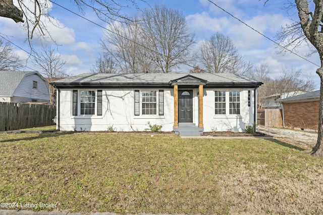 ranch-style home with a front yard