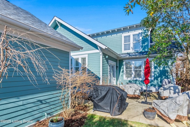 view of property exterior with a patio