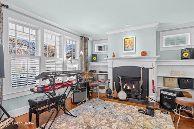 living room with ornamental molding and wood-type flooring