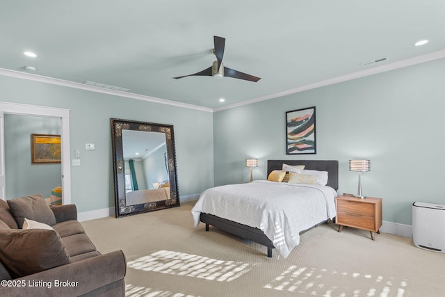 bedroom featuring crown molding, light colored carpet, and ceiling fan