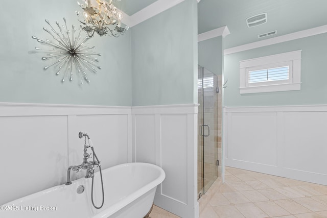 bathroom featuring an inviting chandelier, tile patterned flooring, crown molding, and shower with separate bathtub