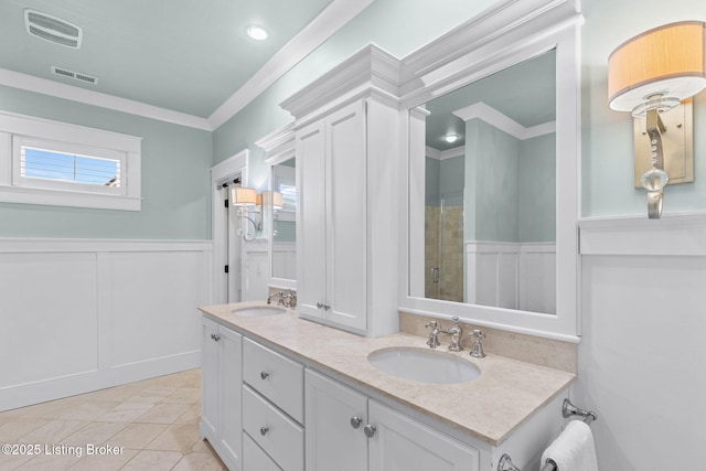 bathroom featuring ornamental molding, vanity, tile patterned floors, and walk in shower