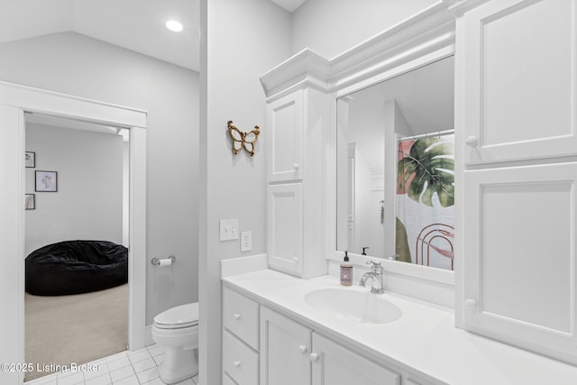 bathroom featuring lofted ceiling, toilet, a shower with curtain, vanity, and tile patterned flooring