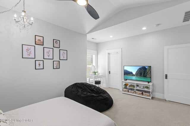 bedroom with lofted ceiling, ceiling fan, and carpet flooring