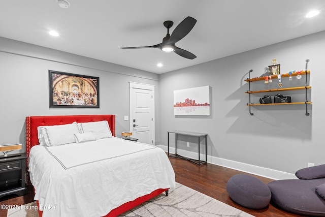 bedroom featuring dark hardwood / wood-style floors and ceiling fan