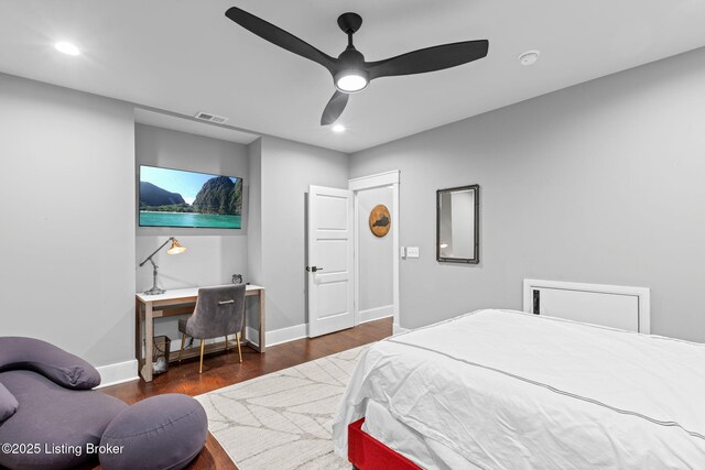 bedroom with dark wood-type flooring and ceiling fan