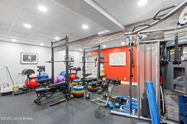 gym featuring a drop ceiling