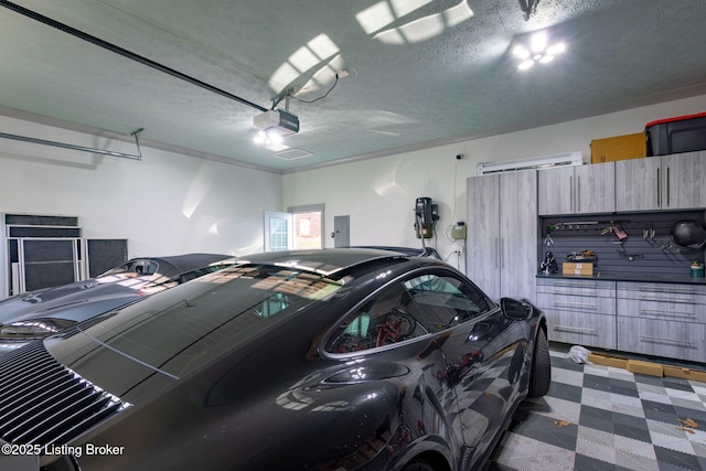 garage featuring a garage door opener and electric panel