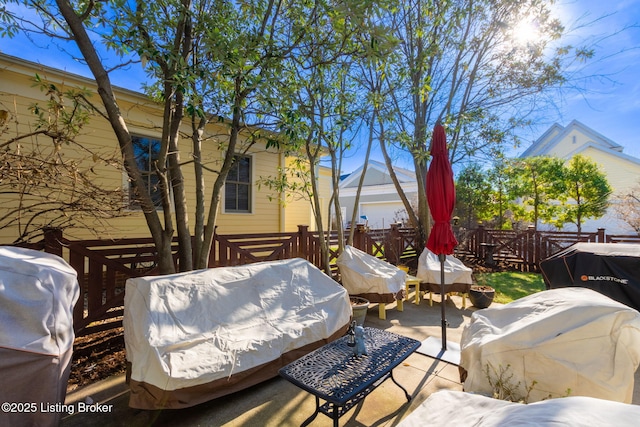 view of patio featuring a grill