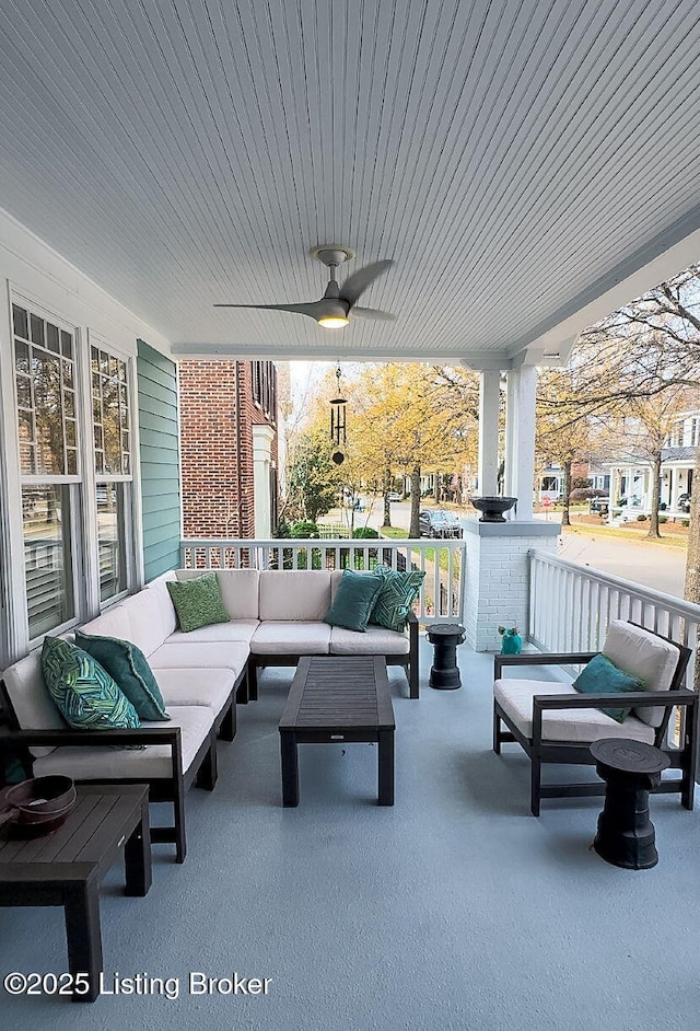 view of patio / terrace with an outdoor living space, ceiling fan, and covered porch