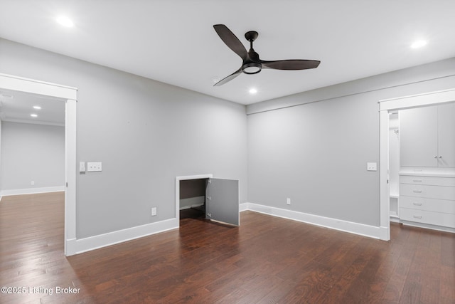 unfurnished bedroom with dark hardwood / wood-style flooring and ceiling fan