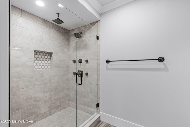 bathroom with a shower with door