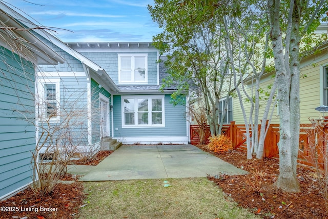 back of property featuring a patio area