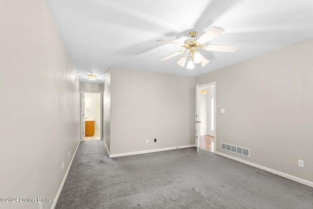 carpeted empty room with ceiling fan