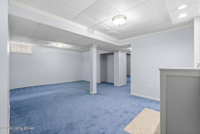 basement featuring carpet floors and ornamental molding