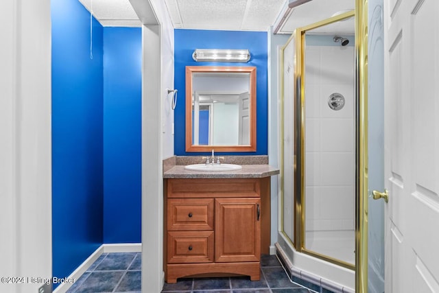 bathroom with tile patterned floors, vanity, and a shower with shower door