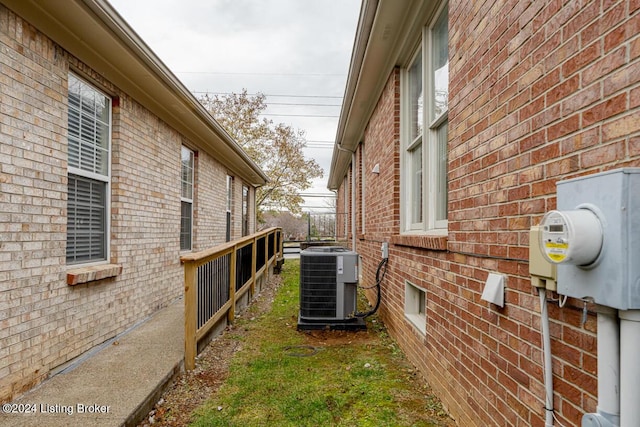 view of side of home featuring cooling unit