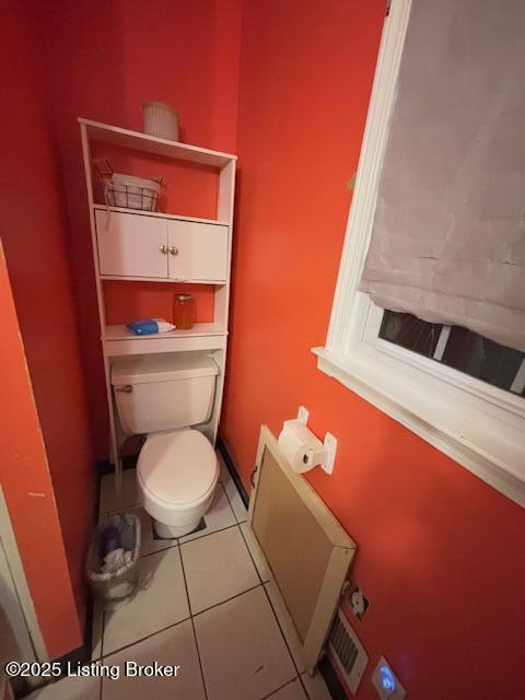 bathroom with tile patterned flooring and toilet