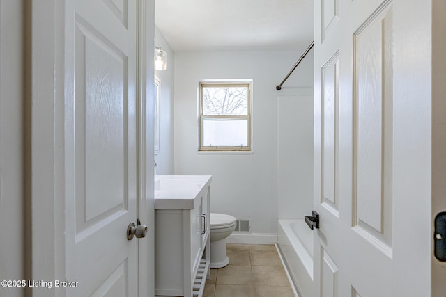 bathroom featuring tile patterned floors, vanity, and toilet