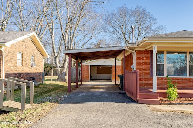 view of side of property with an outbuilding and a carport