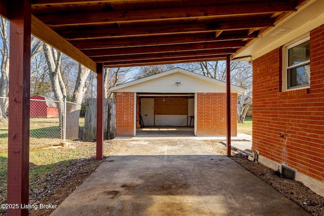 view of patio / terrace featuring an outbuilding and a garage