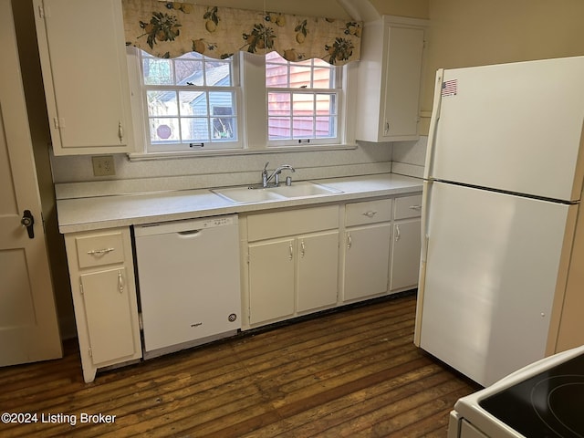 kitchen featuring white appliances, white cabinetry, dark wood-type flooring, and sink