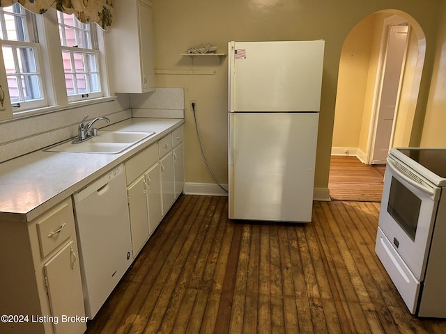 kitchen featuring white cabinets, dark hardwood / wood-style flooring, white appliances, and sink