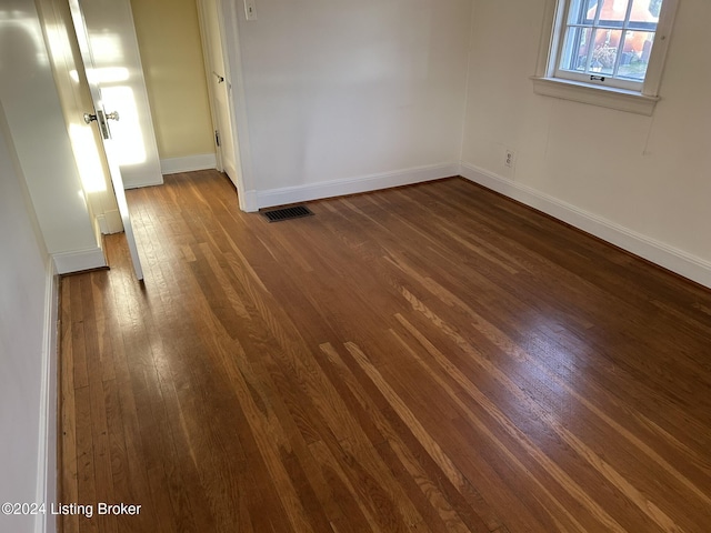 empty room featuring dark hardwood / wood-style floors