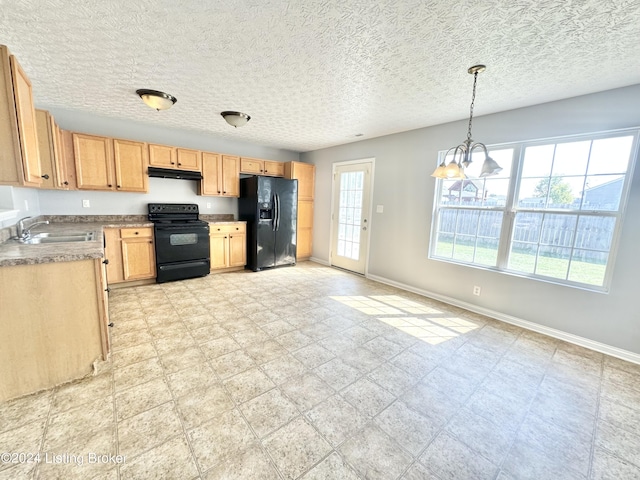 kitchen featuring light brown cabinetry, sink, black appliances, decorative light fixtures, and an inviting chandelier