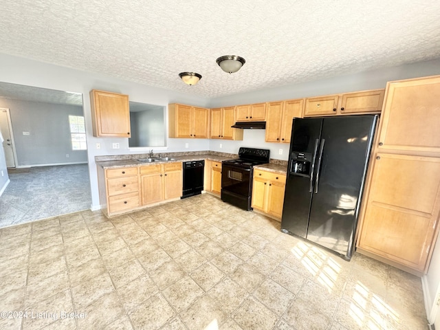 kitchen featuring light brown cabinets, sink, a textured ceiling, and black appliances