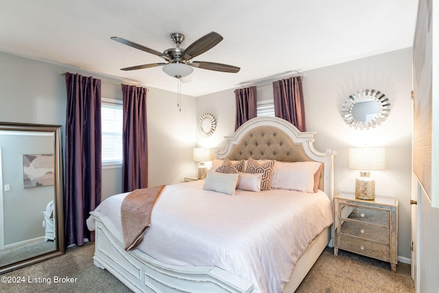 bedroom with ceiling fan and carpet floors