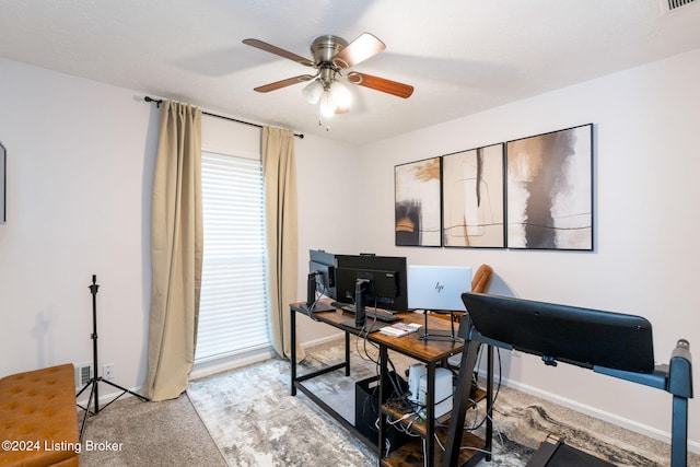 home office featuring carpet and ceiling fan