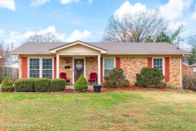 single story home featuring a front yard