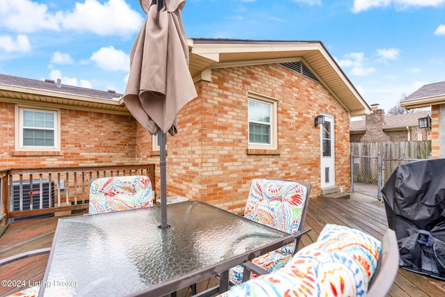 wooden deck with area for grilling