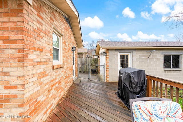 wooden deck featuring grilling area