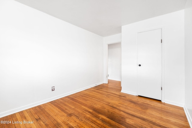 unfurnished bedroom featuring hardwood / wood-style floors