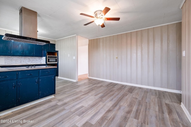 kitchen featuring island exhaust hood, ornamental molding, stainless steel oven, light hardwood / wood-style floors, and blue cabinetry