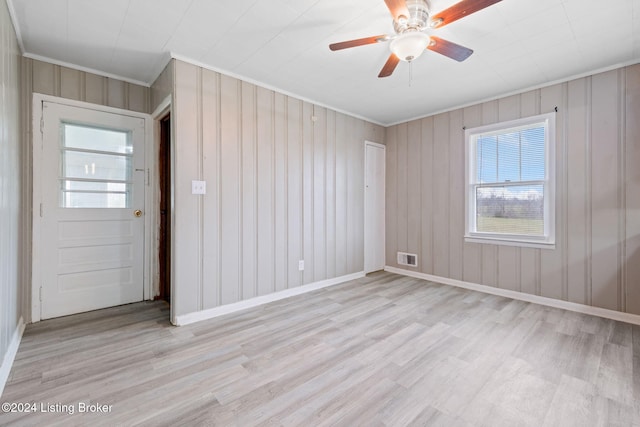 entrance foyer featuring crown molding, ceiling fan, and light wood-type flooring