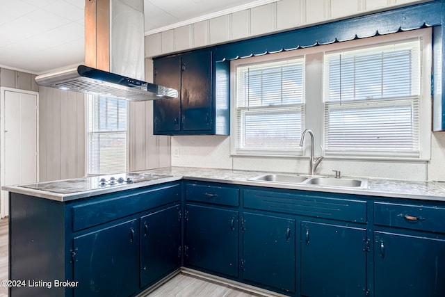 kitchen featuring sink, crown molding, island range hood, kitchen peninsula, and black electric stovetop