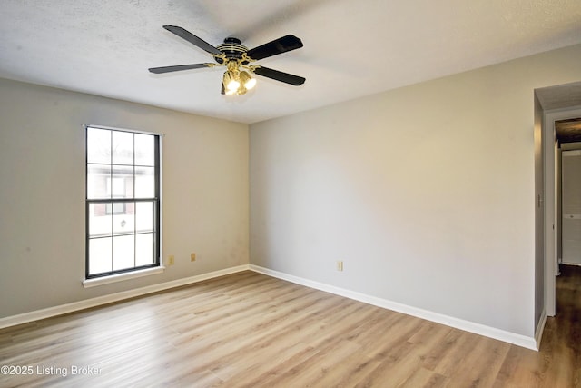 unfurnished room featuring a textured ceiling, ceiling fan, and light hardwood / wood-style flooring