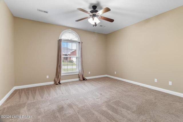 carpeted empty room with ceiling fan